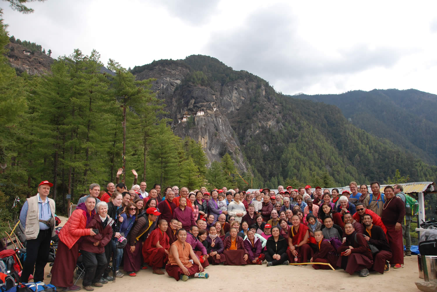 HE Jetsun Khandro Rinpoche, Minling Sangyum Kushok, Jetsun Kushok, Dungse Jigdral, Jetsun Gautami, Kunda Britton, monks and nuns of Mindrolling and sangha members gather at the base of Taktsang in Bhutan.